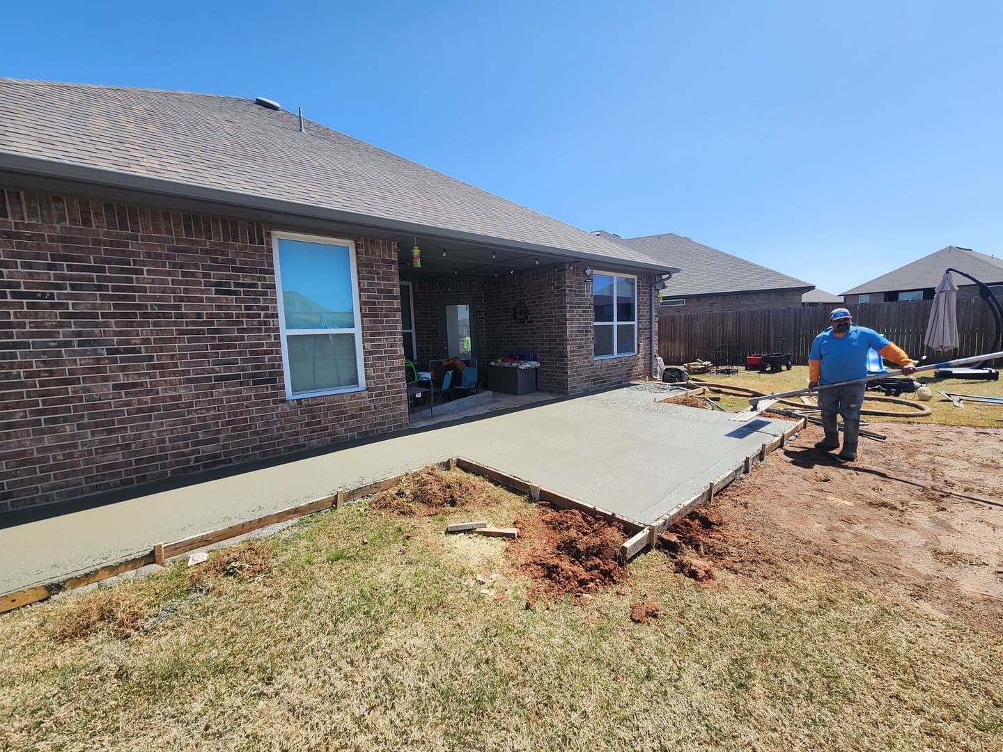 Backyard patio installation with concrete slab in Oklahoma