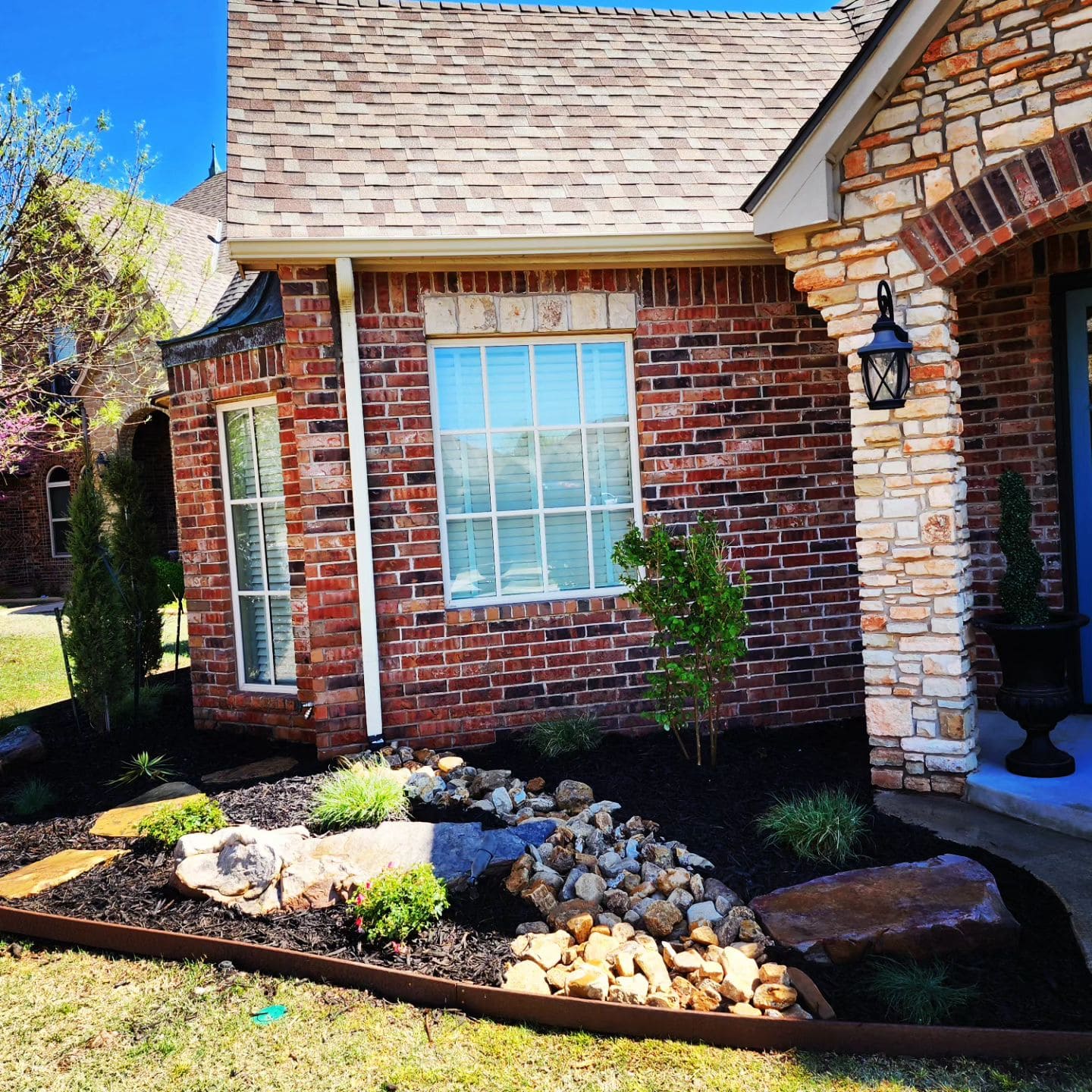 Front yard landscape design with decorative rock garden in Oklahoma