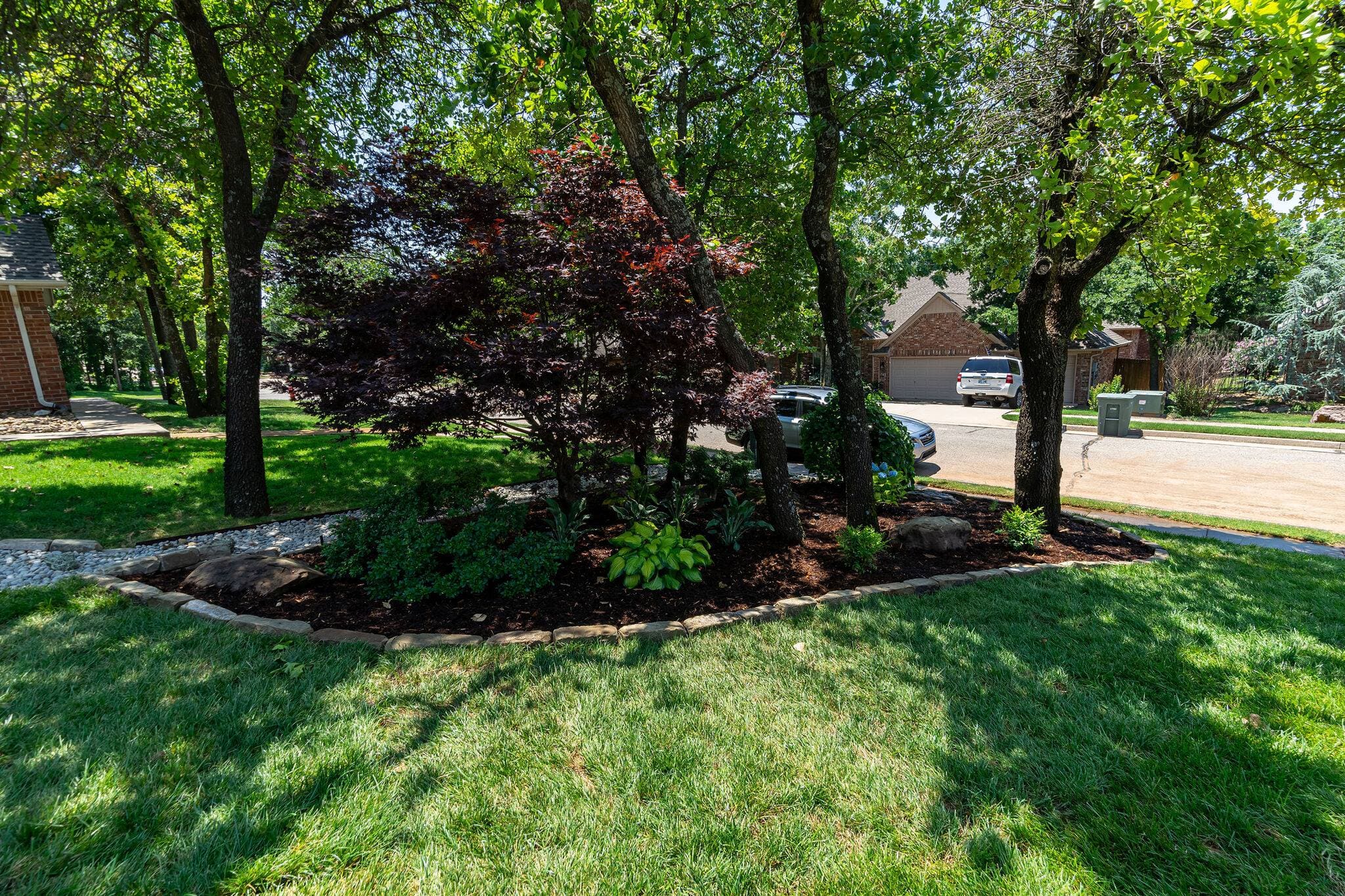 New home front yard landscape installation with shrubs in Oklahoma